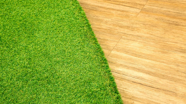 Artificial grass and wooden floor texture for walkway decoration in the building
